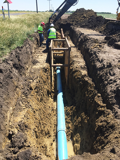 Laying new water pipe for a connector between Sadorus and Champaign, Illinois to provide residents safe, clean drinking water. 