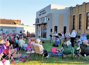 Outdoor community music concert at the Wonewoc public library in Wisconsin.