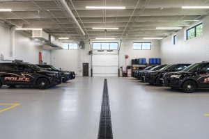 View of the internal car port and police squad car garage at the contemporary new police station in Sauk City, Wisconsin