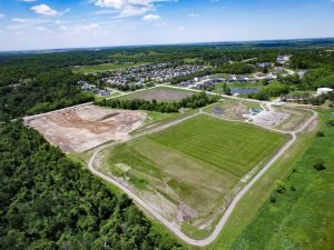 Aerial view of large vacant parcel in Hiawatha Iowa that is being developed into a park and splash pad