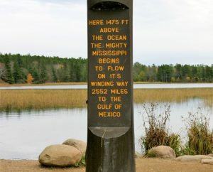 Image of the sign at Itasca State Park in Minnesota marking the headwaters of the Mississippi river