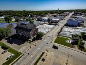 Stunning aerial photograph of downtown Independence Iowa, bisected by the Wapsipinicon River and site of an historic mill.