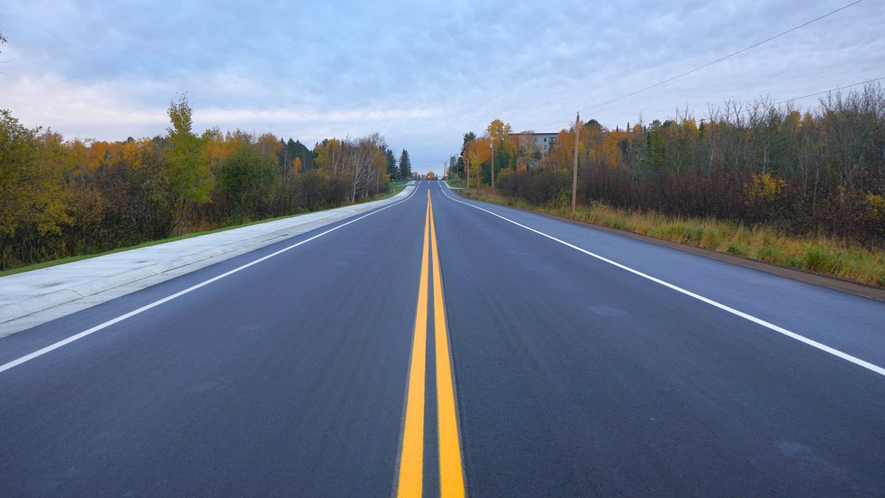 Finished photograph of newly resurfaced Ugstad Road in the City of Hermantown Minnesota.