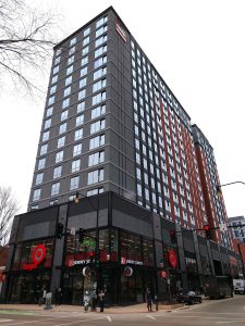 The Dean in the heart of campustown in Champaign Illinois is a mixed-use development of modern student apartments complemented with first-floor retail.