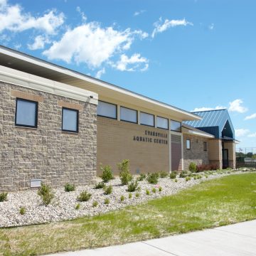 Photo of the exterior of a new aquatic center facility in the city of evansville, wisconsin